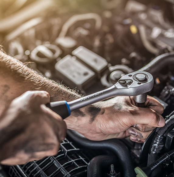 Auto mechanic working and repair on car engine